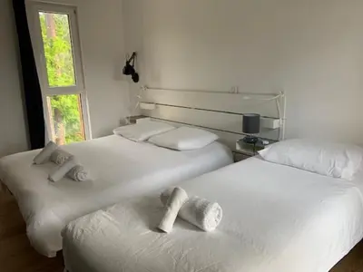 Un ou plusieurs lits dans un hébergement de l'établissement Villa d'Exception 7 chambres au coeur du golf de Biscarrosse