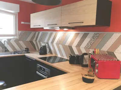 Cuisine ou kitchenette dans l'établissement La coccinelle
