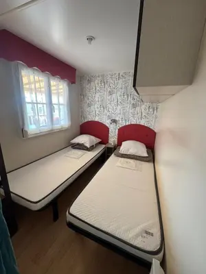 Un ou plusieurs lits dans un hébergement de l'établissement MH J08 - Camping Siblu La plage