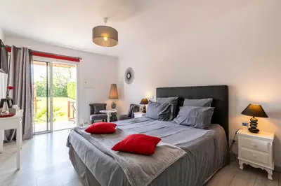 Un ou plusieurs lits dans un hébergement de l'établissement Gîte & Chambres d'Hôtes - Le Petit Bali