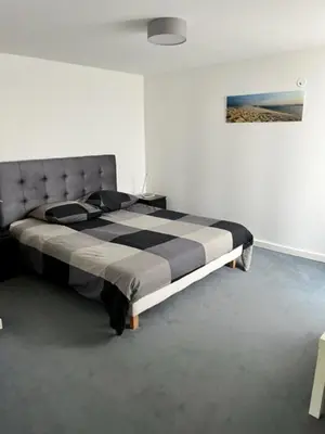 Un ou plusieurs lits dans un hébergement de l'établissement Les Locations du Bassin Appartements Alexandre