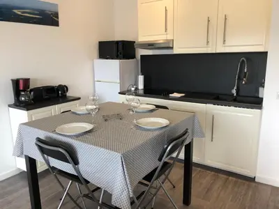 Cuisine ou kitchenette dans l'établissement Les Locations du Bassin Appartements Alexandre