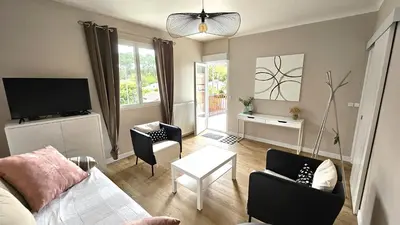Télévision ou salle de divertissement dans l'établissement Location Fantaisie Ondres