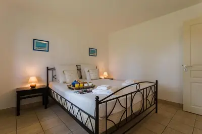 Un ou plusieurs lits dans un hébergement de l'établissement Madame Vacances Villas la Clairière aux Chevreuils