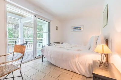 Un ou plusieurs lits dans un hébergement de l'établissement Madame Vacances Villas Club Royal Ocean 17