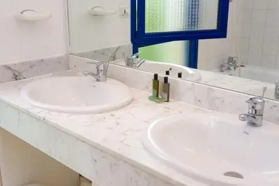 Salle de bains dans l'établissement Madame Vacances Villas Club Royal Aquitaine