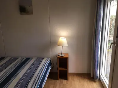 Un ou plusieurs lits dans un hébergement de l'établissement Résidence Mes Amours d'Enfants - Les Villas du Lac