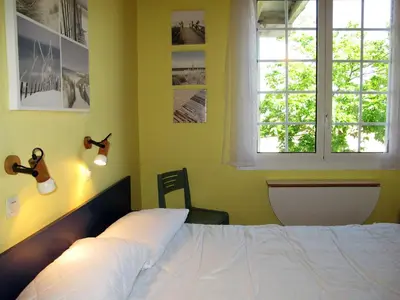 Un ou plusieurs lits dans un hébergement de l'établissement Apartment Capama-1 by Interhome