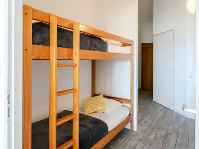 Un ou plusieurs lits dans un hébergement de l'établissement Apartment les Goelands by Interhome