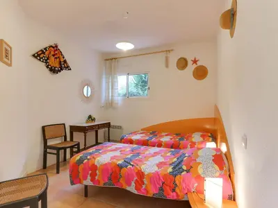 Un ou plusieurs lits dans un hébergement de l'établissement Holiday Home Les Pinasses by Interhome