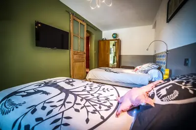 Un ou plusieurs lits dans un hébergement de l'établissement Les chambres de Lily