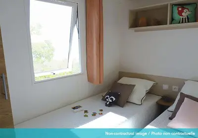 Un ou plusieurs lits dans un hébergement de l'établissement Camping Officiel Siblu Les Dunes de Contis