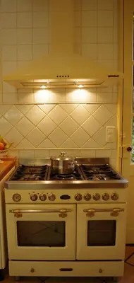 Cuisine ou kitchenette dans l'établissement Maison Au Jardin