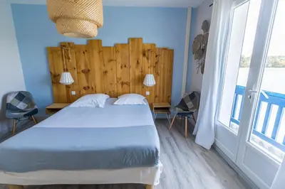 Un ou plusieurs lits dans un hébergement de l'établissement Le Relais Du Lac