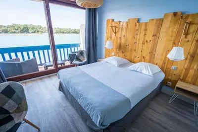 Un ou plusieurs lits dans un hébergement de l'établissement Le Relais Du Lac