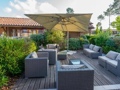 Coin salon dans l'établissement Apartment Les Cottages du Lac T3 Tradition by Interhome