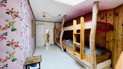 Un ou plusieurs lits dans un hébergement de l'établissement Carwyns Surf House
