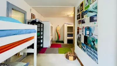 Un ou plusieurs lits dans un hébergement de l'établissement Carwyns Surf House