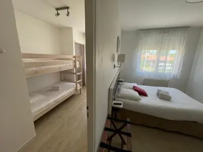Un ou plusieurs lits dans un hébergement de l'établissement Auberge Les Mufliers - Hôtel Les Forges