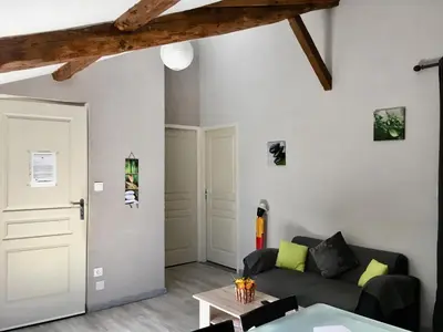 Coin salon dans l'établissement Appartement Boucou