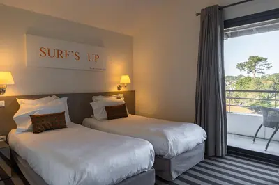Un ou plusieurs lits dans un hébergement de l'établissement Hotel 202