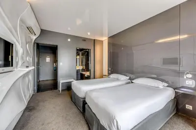 Un ou plusieurs lits dans un hébergement de l'établissement Comfort Aparthotel Bassin d'Arcachon