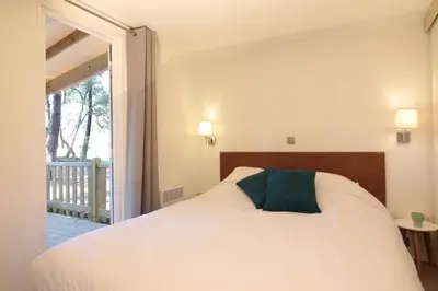 Un ou plusieurs lits dans un hébergement de l'établissement Green Resort