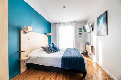 Un ou plusieurs lits dans un hébergement de l'établissement Hotel Helios - Golf