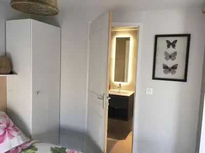 Un ou plusieurs lits dans un hébergement de l'établissement Le Patio du bourg - Studio entre lac et océan