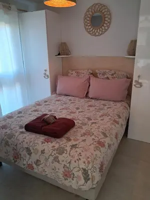 Un ou plusieurs lits dans un hébergement de l'établissement Le Patio du bourg - Studio entre lac et océan