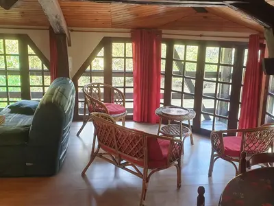 Coin salon dans l'établissement Moulin de Saint Cricq - Gîte insolite