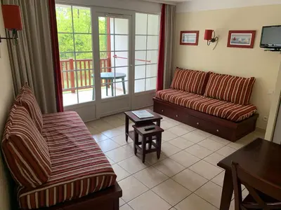 Coin salon dans l'établissement Appartement dans résidence de vacances
