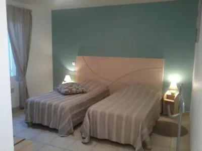 Un ou plusieurs lits dans un hébergement de l'établissement Au Coeur Des Landes
