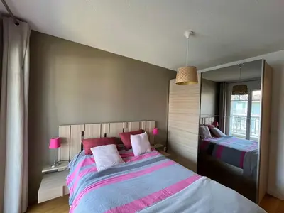 Un ou plusieurs lits dans un hébergement de l'établissement Appartement T4 avec Terrasse, Piscine et Proche Dune du Pyla - FR-1-319-154