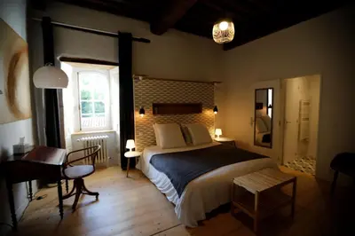 Un ou plusieurs lits dans un hébergement de l'établissement Chateau Saint Martin B&B