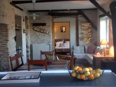 Coin salon dans l'établissement Cottage Narbay