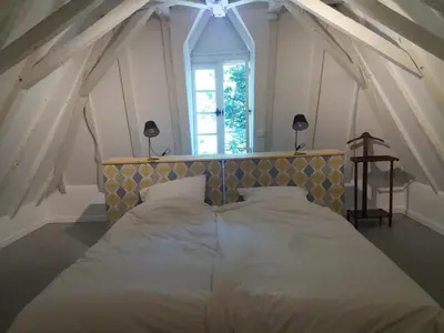 Un ou plusieurs lits dans un hébergement de l'établissement La Chapelle du Chateau Gîte
