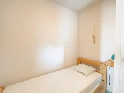 Un ou plusieurs lits dans un hébergement de l'établissement Appartement 1 chambre, 2 cabines - 4 pers - Vue océan - FR-1-379-80