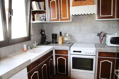 Cuisine ou kitchenette dans l'établissement Gîte de Broustic
