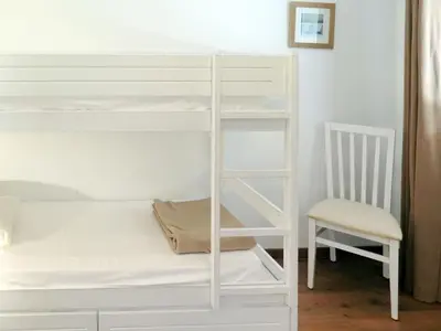 Un ou plusieurs lits dans un hébergement de l'établissement Apartment Les Cottages du Lac T1 Tradition by Interhome