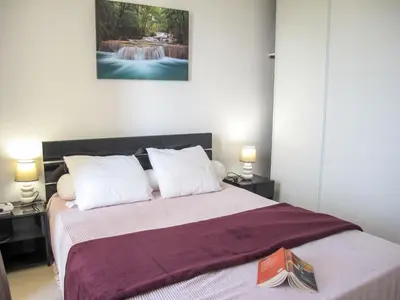 Un ou plusieurs lits dans un hébergement de l'établissement Apartment Grand Pavois-5 by Interhome