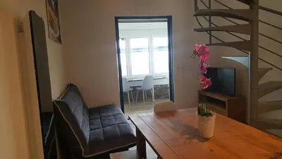 Coin salon dans l'établissement Appartement CAPBRETON face à l'océan sans vis à vis, avec piscine