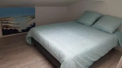 Un ou plusieurs lits dans un hébergement de l'établissement Appartement CAPBRETON face à l'océan sans vis à vis, avec piscine