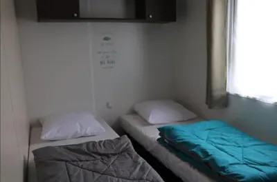 Un ou plusieurs lits dans un hébergement de l'établissement MH 395 3 chambres et 1 salle de bain dans camping 4 étoiles