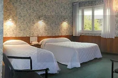 Un ou plusieurs lits dans un hébergement de l'établissement Hôtel du Sablar