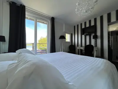 Un ou plusieurs lits dans un hébergement de l'établissement L auberge de la pointe