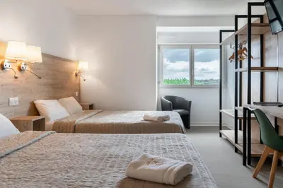 Un ou plusieurs lits dans un hébergement de l'établissement Abor Hôtel, Mont de Marsan