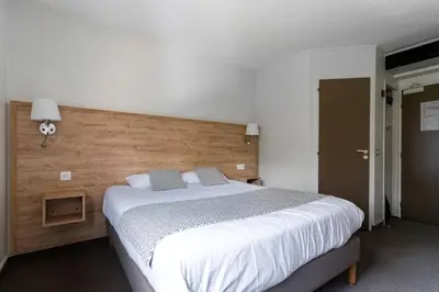 Un ou plusieurs lits dans un hébergement de l'établissement Abor Hôtel, Mont de Marsan