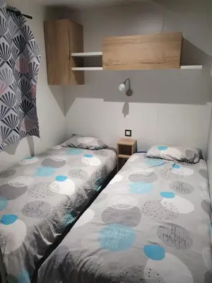 Un ou plusieurs lits dans un hébergement de l'établissement Mobilhome a Gastes