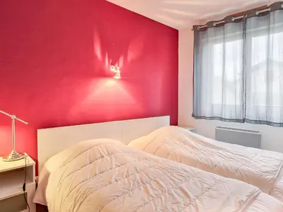 Un ou plusieurs lits dans un hébergement de l'établissement Apartment Cantegrit by Interhome